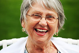 Photo of a woman smiling. Link to Gifts That Pay You Income.