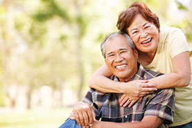 Photo of a couple smiling. Link to Gifts of Real Estate.