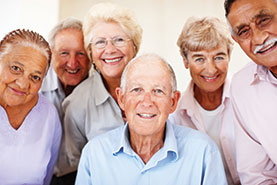 Photo of a group of people smiling. Link to Tangible Personal Property.